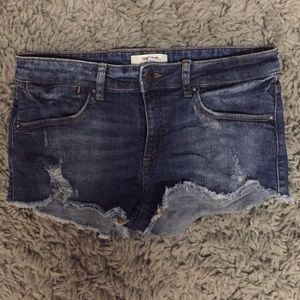 Distressed denim shorts